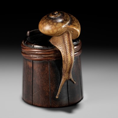 Lot 129 - SHIGEMASA: A SUPERB WOOD NETSUKE OF A SNAIL ON BUCKET