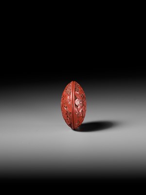 Lot 288 - A FINE TSUISHU (CARVED RED LACQUER) MANJU NETSUKE WITH PEACH BLOSSOMS