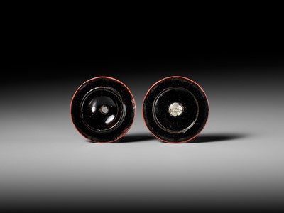 Lot 288 - A FINE TSUISHU (CARVED RED LACQUER) MANJU NETSUKE WITH PEACH BLOSSOMS