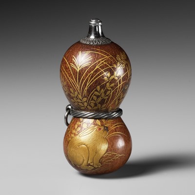Lot 432 - A FINE AND LARGE LACQUERED GOURD NETSUKE WITH A CHUBBY HARE AMONGST AUTUMN GRASSES