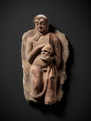 Lot 338 - A RARE POLYCHROME STUCCO RELIEF DEPICTING A MONK WITH A SKULL, ANCIENT REGION OF GANDHARA