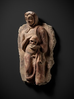 Lot 338 - A RARE POLYCHROME STUCCO RELIEF DEPICTING A MONK WITH A SKULL, ANCIENT REGION OF GANDHARA