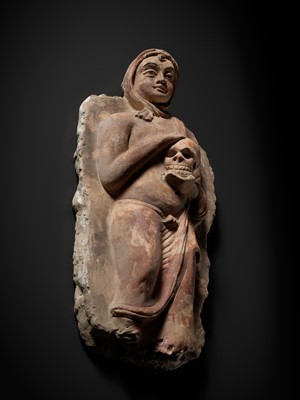 Lot 338 - A RARE POLYCHROME STUCCO RELIEF DEPICTING A MONK WITH A SKULL, ANCIENT REGION OF GANDHARA