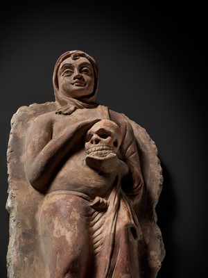 Lot 338 - A RARE POLYCHROME STUCCO RELIEF DEPICTING A MONK WITH A SKULL, ANCIENT REGION OF GANDHARA