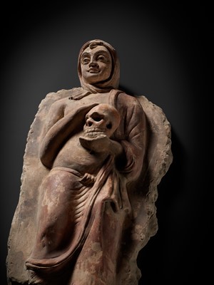 Lot 338 - A RARE POLYCHROME STUCCO RELIEF DEPICTING A MONK WITH A SKULL, ANCIENT REGION OF GANDHARA