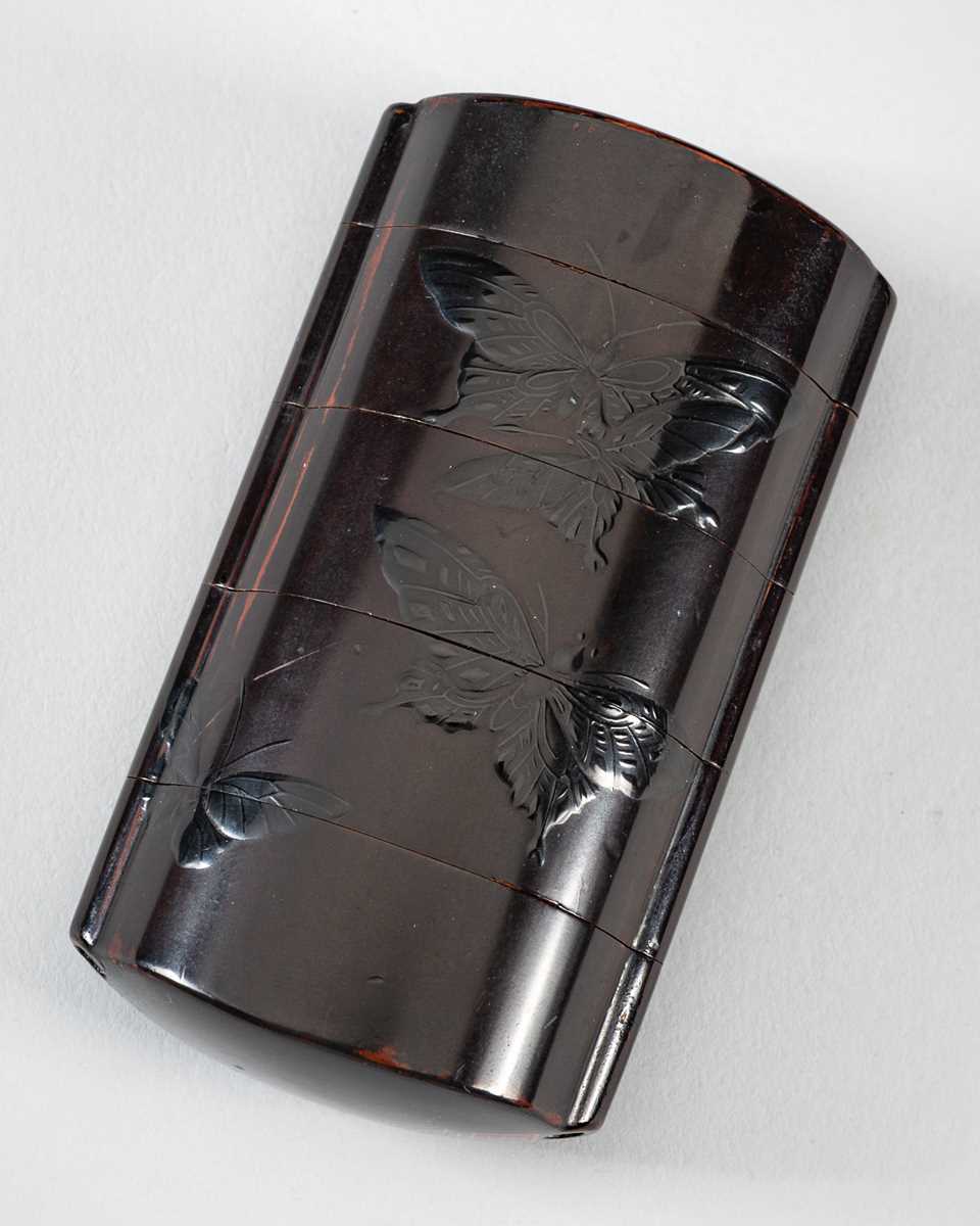 Lot 1419 - SHIGENORI: A FINE FOUR-CASE BLACK ON BLACK LACQUER INRO WITH BUTTERFLIES