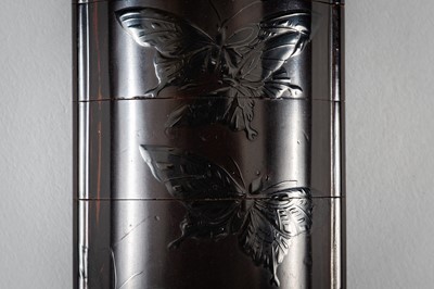 Lot 1419 - SHIGENORI: A FINE FOUR-CASE BLACK ON BLACK LACQUER INRO WITH BUTTERFLIES