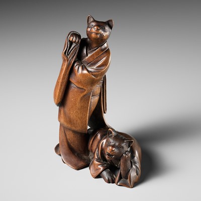 Lot 387 - A RARE WOOD OKIMONO OF A CAT GEISHA AND CLIENT