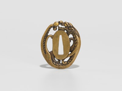 Lot 228 - A FINE YOSHIYUKI SCHOOL SENTOKU TSUBA IN THE FORM OF A DRAGON