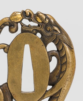 Lot 228 - A FINE YOSHIYUKI SCHOOL SENTOKU TSUBA IN THE FORM OF A DRAGON