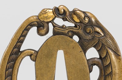 Lot 228 - A FINE YOSHIYUKI SCHOOL SENTOKU TSUBA IN THE FORM OF A DRAGON