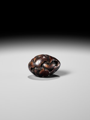 NAITO TOYOMASA: A FINE WOOD NETSUKE OF A DRAGON EMERGING FROM AN EGG