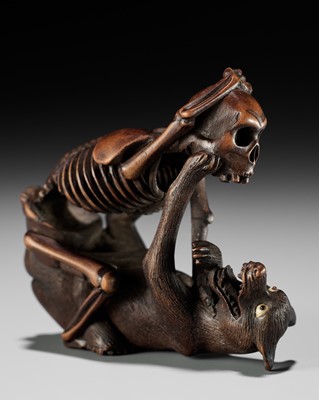 Lot 98 - A FINE WOOD NETSUKE OF A WOLF AND SKELETON, ATTRIBUTED TO SHOKO SUGONOYA