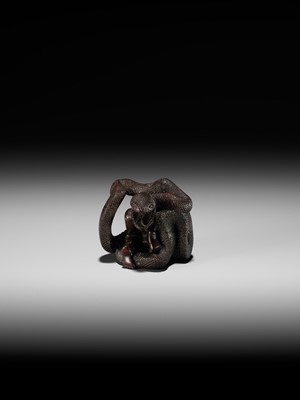 A VERY RARE SHUNGA WOOD NETSUKE OF A NAKED WOMAN AND GIANT SNAKE