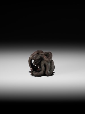 A VERY RARE SHUNGA WOOD NETSUKE OF A NAKED WOMAN AND GIANT SNAKE