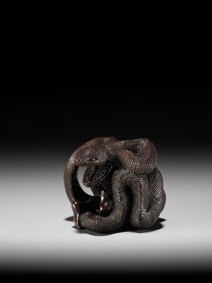 A VERY RARE SHUNGA WOOD NETSUKE OF A NAKED WOMAN AND GIANT SNAKE