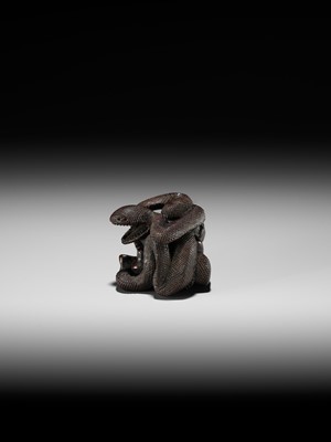 A VERY RARE SHUNGA WOOD NETSUKE OF A NAKED WOMAN AND GIANT SNAKE