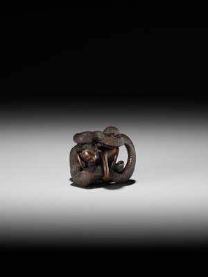 A VERY RARE SHUNGA WOOD NETSUKE OF A NAKED WOMAN AND GIANT SNAKE