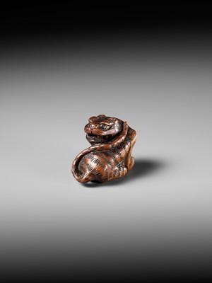Lot 457 - MINKO: A POWERFUL WOOD NETSUKE OF A TIGER