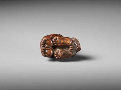 Lot 457 - MINKO: A POWERFUL WOOD NETSUKE OF A TIGER