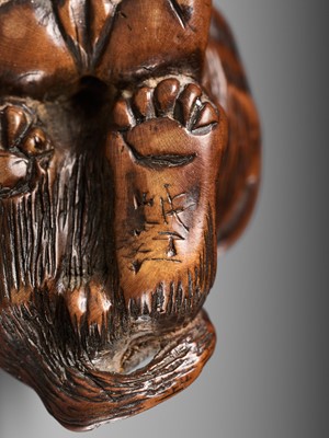 Lot 457 - MINKO: A POWERFUL WOOD NETSUKE OF A TIGER