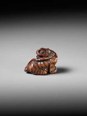 Lot 457 - MINKO: A POWERFUL WOOD NETSUKE OF A TIGER
