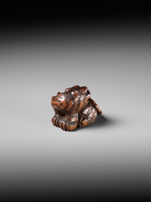 Lot 457 - MINKO: A POWERFUL WOOD NETSUKE OF A TIGER