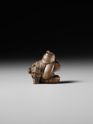 Lot 437 - MIWA: A WOOD NETSUKE OF A BOY HIDING A HANYA MASK