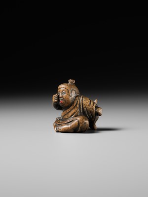 Lot 437 - MIWA: A WOOD NETSUKE OF A BOY HIDING A HANYA MASK