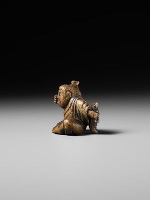 Lot 437 - MIWA: A WOOD NETSUKE OF A BOY HIDING A HANYA MASK