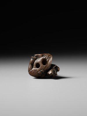 Lot 437 - MIWA: A WOOD NETSUKE OF A BOY HIDING A HANYA MASK