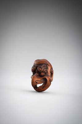 Lot 492 - GYOKUSHUN: A WOOD MASK NETSUKE OF A KARASU TENGU
