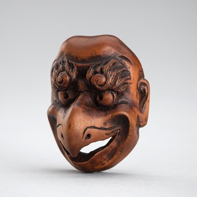 Lot 492 - GYOKUSHUN: A WOOD MASK NETSUKE OF A KARASU TENGU