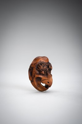 Lot 492 - GYOKUSHUN: A WOOD MASK NETSUKE OF A KARASU TENGU