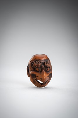Lot 492 - GYOKUSHUN: A WOOD MASK NETSUKE OF A KARASU TENGU
