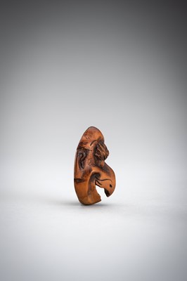 Lot 492 - GYOKUSHUN: A WOOD MASK NETSUKE OF A KARASU TENGU