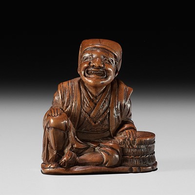 Lot 165 - GYOKURINTEI: A WOOD NETSUKE OF A FARMER TAKING A BREAK