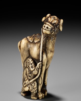 Lot 625 - TOMOSADA: A VERY RARE ANTLER NETSUKE OF A FOREIGN WRANGLER WITH A CAMEL