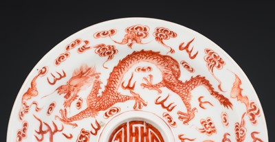 AN IRON-RED AND GILT ‘DRAGON’ SAUCER, JIAQING MARK AND POSSIBLY OF THE PERIOD