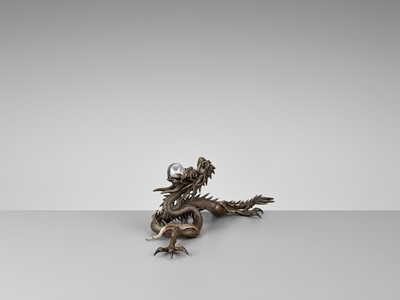 Lot 25 - A BRONZE OKIMONO OF A DRAGON WITH ROCK CRYSTAL BALL