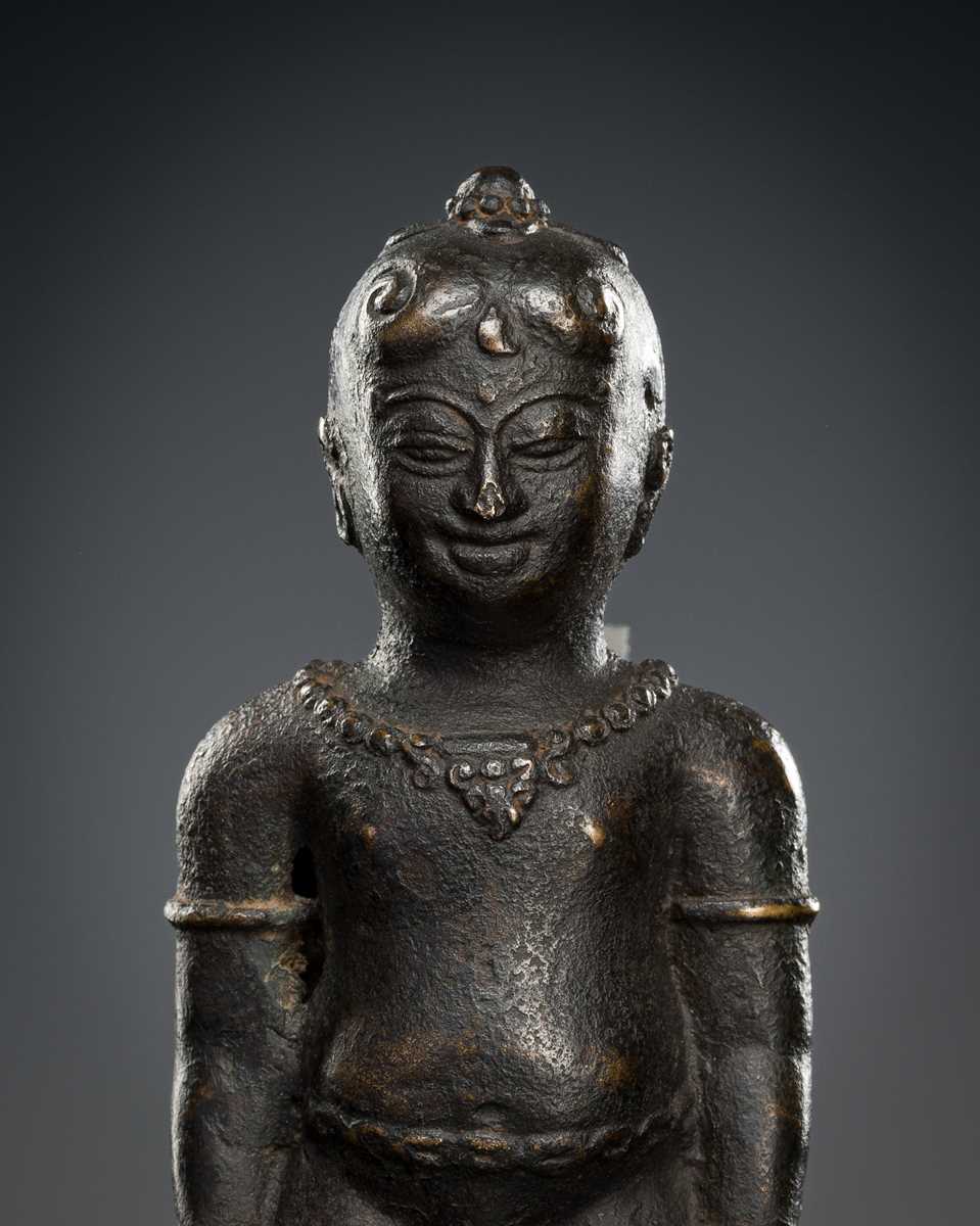 Lot 413 - A BRONZE FIGURE FRAGMENT OF A NOBLE BOY, MAJAPAHIT, 14TH CENTURY