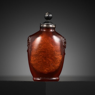 Lot 489 - A SMALL SILVER-MOUNTED AND CARVED AMBER SNUFF BOTTLE, 1750-1820