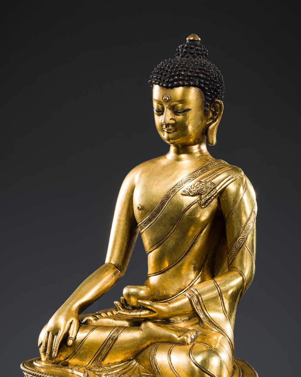 Lot 21 - A GILT BRONZE FIGURE OF BUDDHA SHAKYAMUNI, TIBET, 18TH – 19th CENTURY