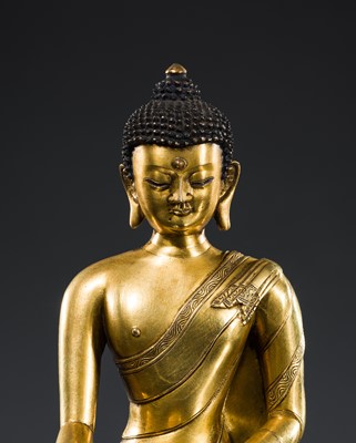 Lot 21 - A GILT BRONZE FIGURE OF BUDDHA SHAKYAMUNI, TIBET, 18TH – 19th CENTURY