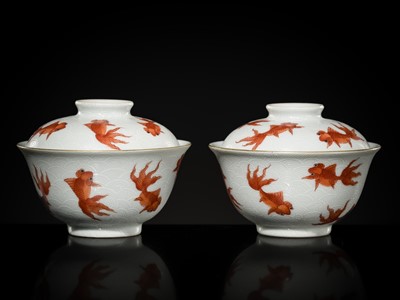 Lot 259 - A PAIR OF INCISED IRON-RED-DECORATED ‘GOLDFISH’ BOWLS AND COVERS, DAOGUANG MARK AND PROBABLY OF THE PERIOD