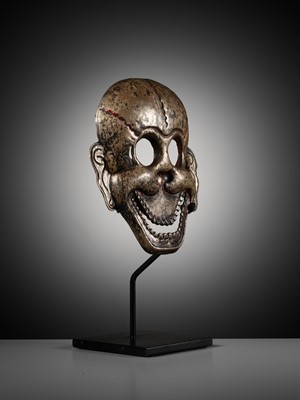 Lot 2 - A SILVER REPOUSSÉ MASK OF A CHITIPATI, TIBET, 18TH-19TH CENTURY