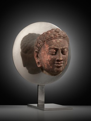 Lot 241 - A RARE MOTTLED RED SANDSTONE HEAD OF A JAIN TIRTHANKARA, MATHURA, KUSHAN PERIOD