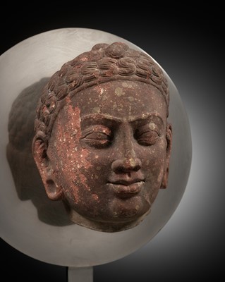 Lot 241 - A RARE MOTTLED RED SANDSTONE HEAD OF A JAIN TIRTHANKARA, MATHURA, KUSHAN PERIOD