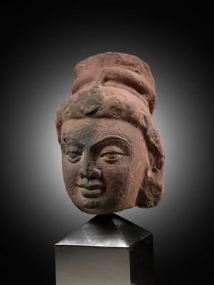 Lot 629 - A RARE MOTTLED RED SANDSTONE HEAD OF A YAKSHI, MATHURA