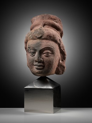 Lot 629 - A RARE MOTTLED RED SANDSTONE HEAD OF A YAKSHI, MATHURA